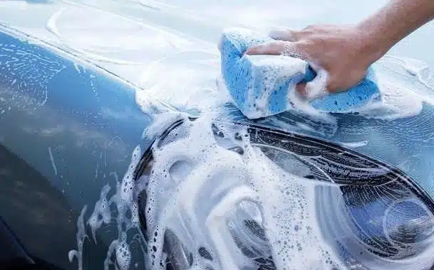 Step-by-step vinyl wrap cleaning guide showing safe car wash methods without damage