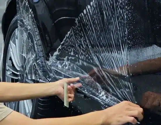 Car vinyl wrap protecting against scratches with gloss, satin, and matte finishes.