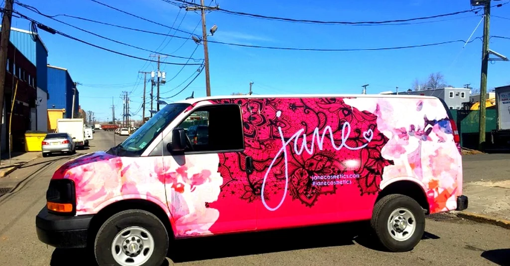Modern delivery van wrap with eye-catching business graphics